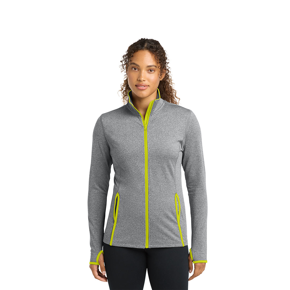 Woman wearing a gray jacket with green accents on a white background