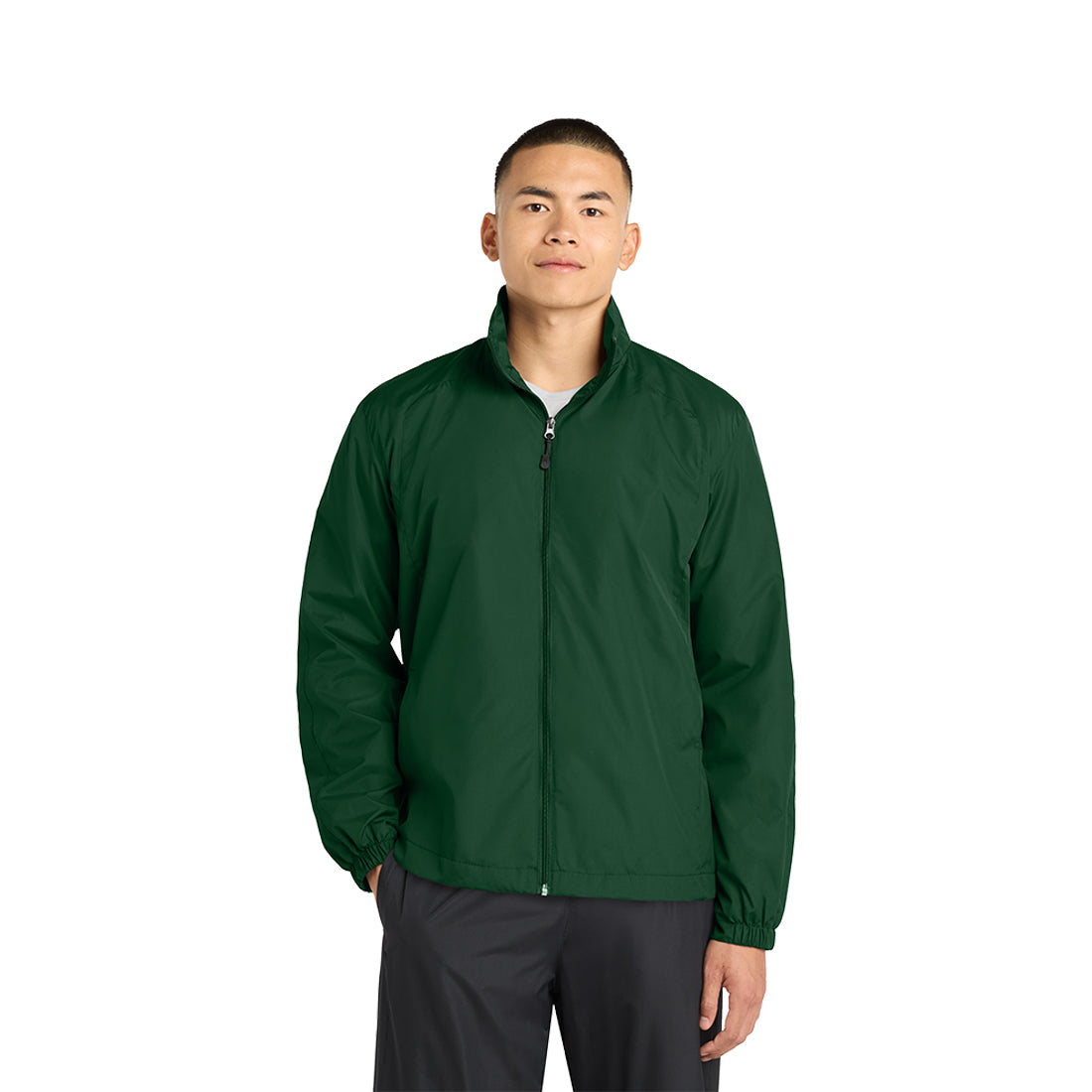 Man wearing a green jacket on a white background.