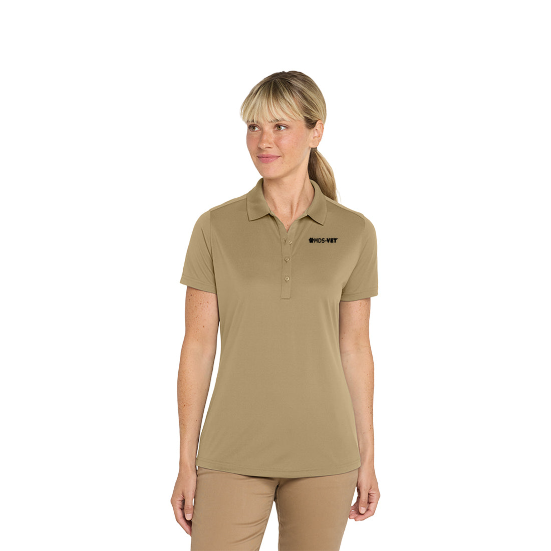 Woman wearing a tan polo shirt with a logo on a white background