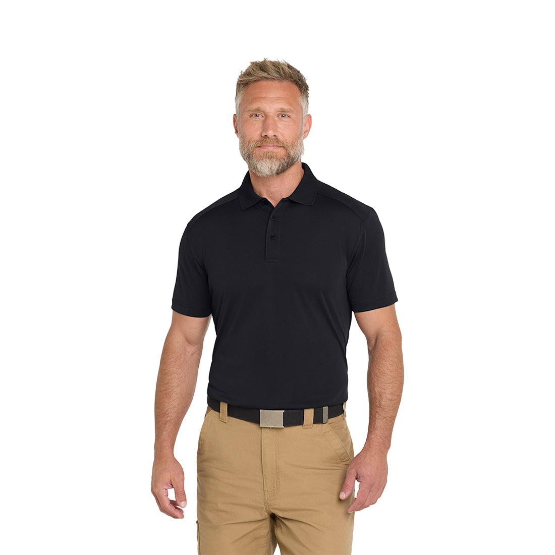 Man wearing a navy blue polo shirt and beige pants on a white background