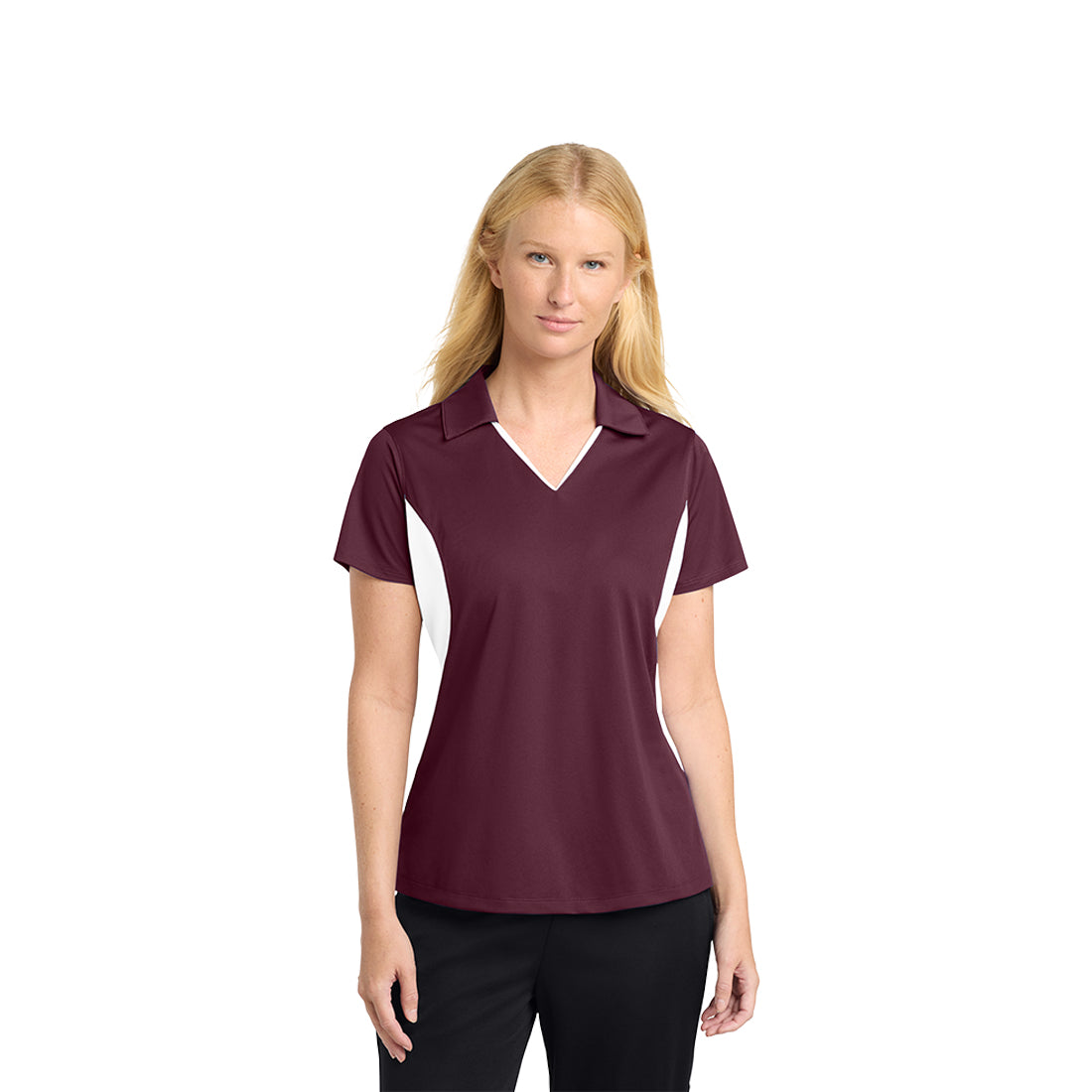 Woman wearing a maroon and white polo shirt on a white background