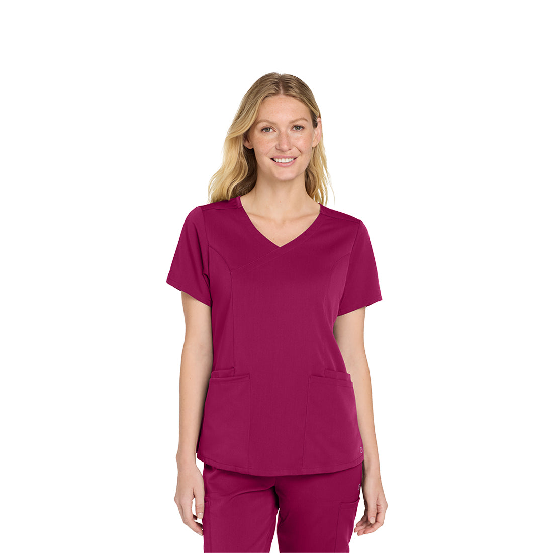 Woman wearing a wine scrub set on a white background