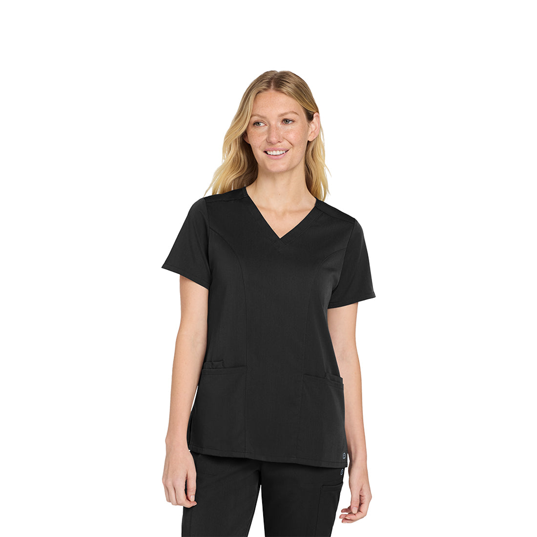 Woman wearing a black scrub top on a white background