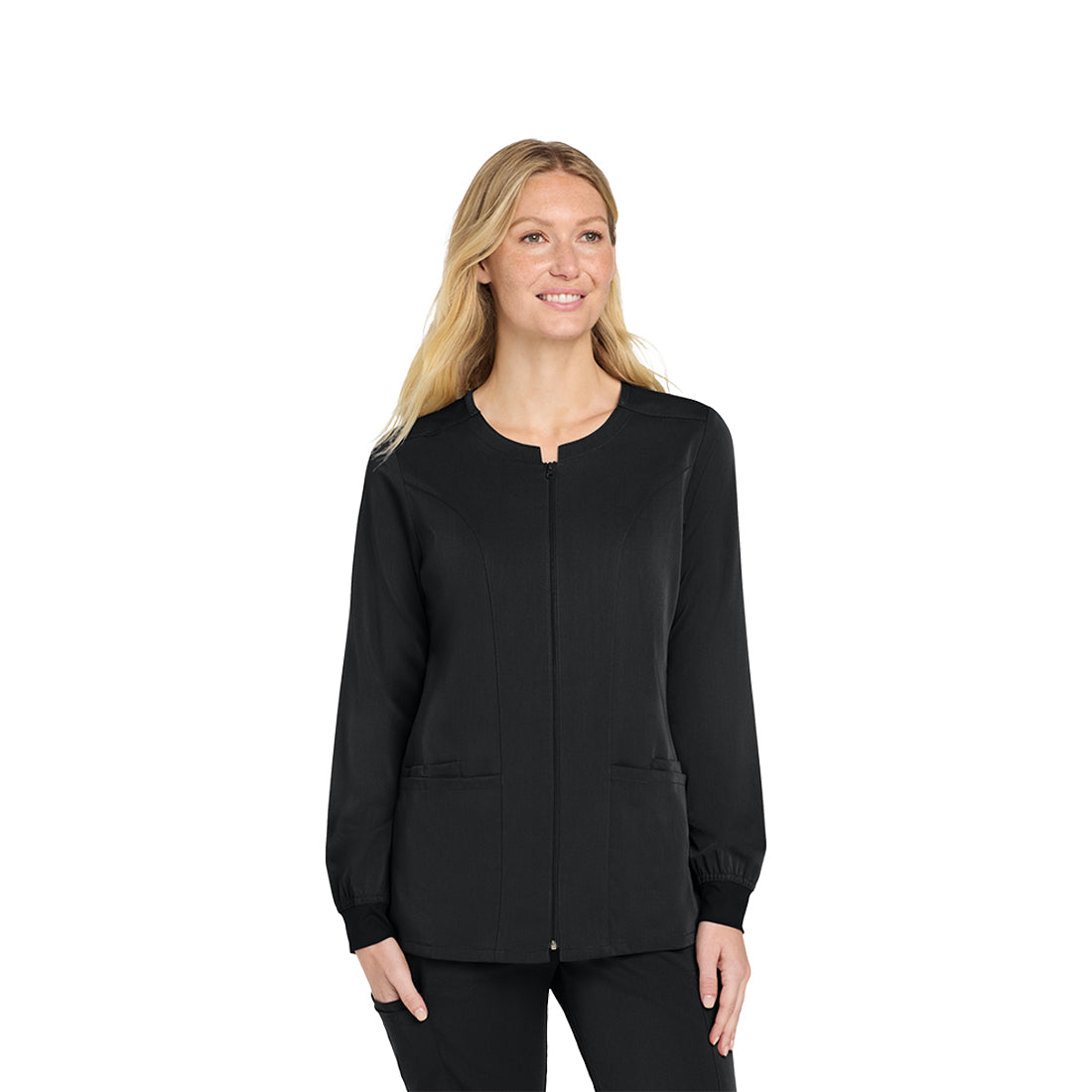 Woman wearing a black scrub top on a white background