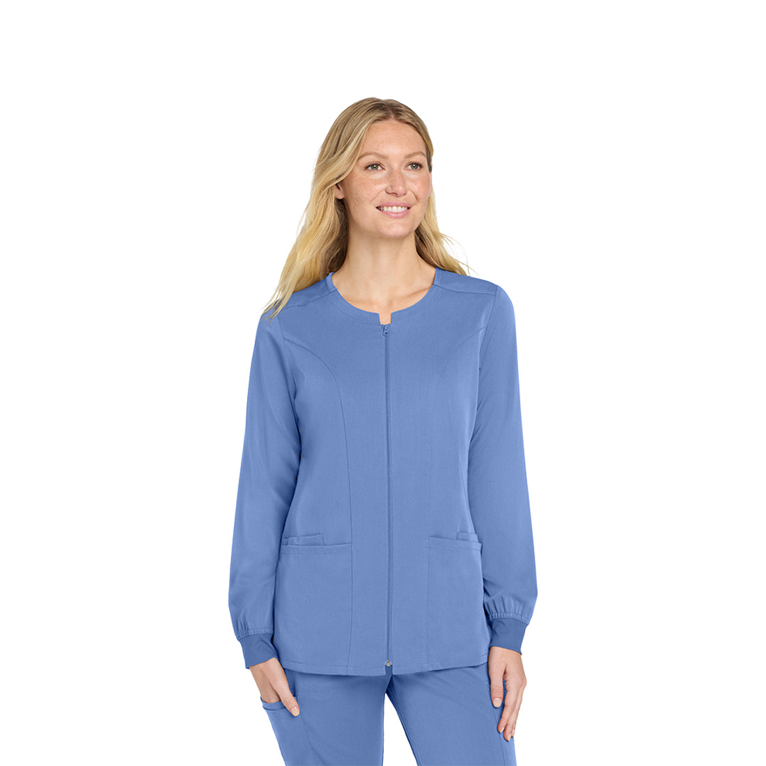 Woman wearing a blue scrub top and pants on a white background
