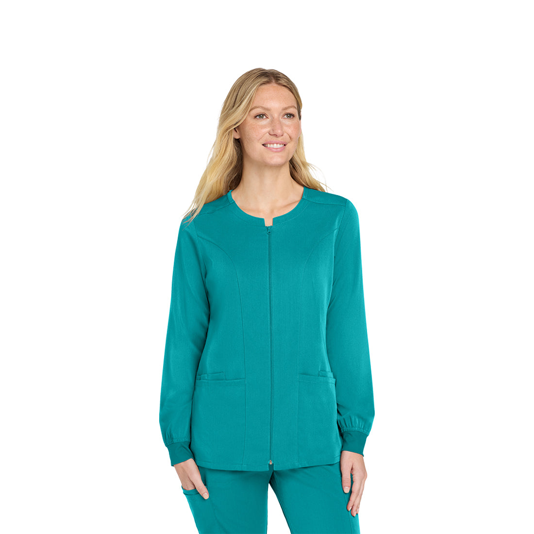 Woman wearing a teal scrub top on a white background