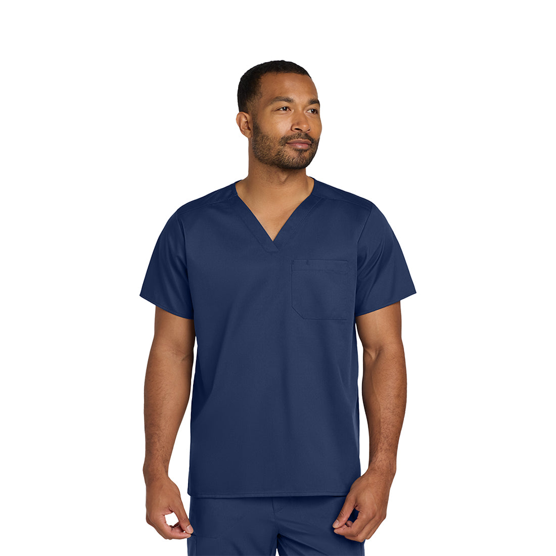 Man wearing a navy blue scrub set on a white background