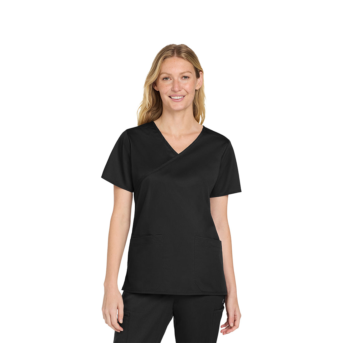Woman wearing a black scrub set on a white background