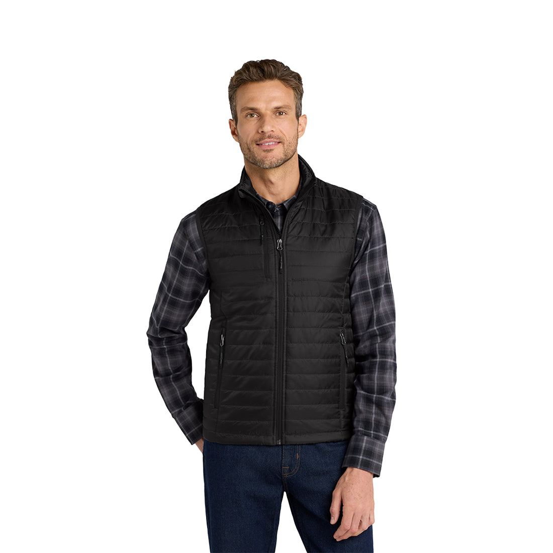 Man wearing a black quilted vest over a gray shirt on a white background